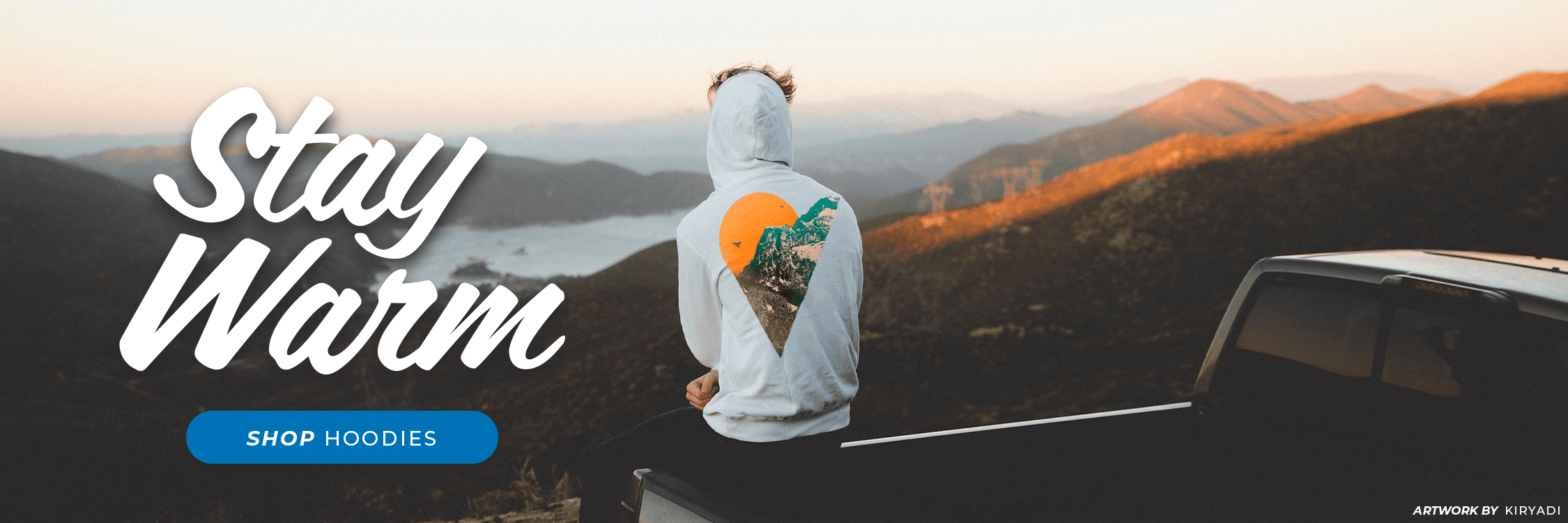 Stay Warm. Shop Hoodies. Graphic of man sitting on mountain.